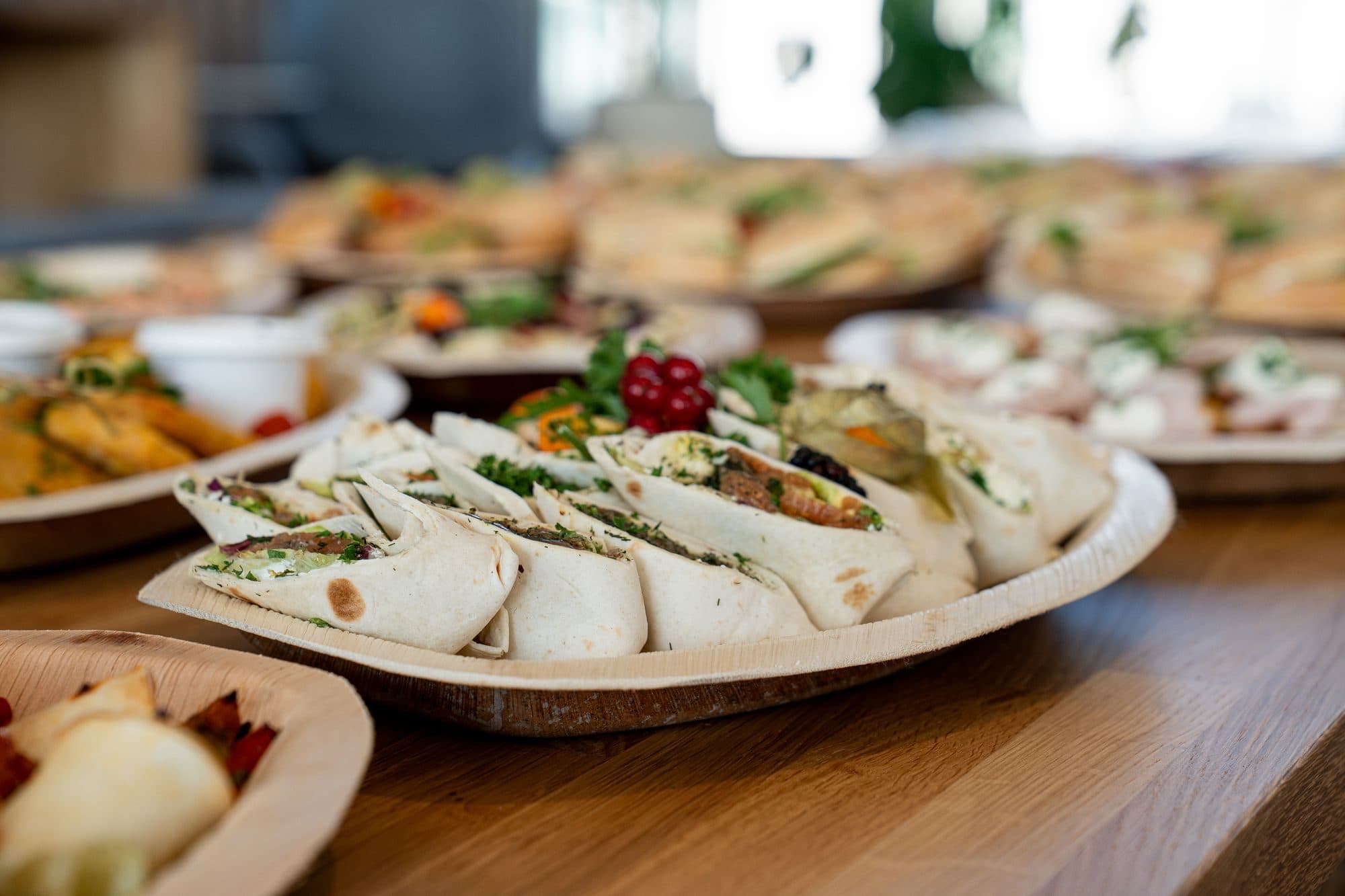 A platter of sliced tortilla wraps with fresh fillings